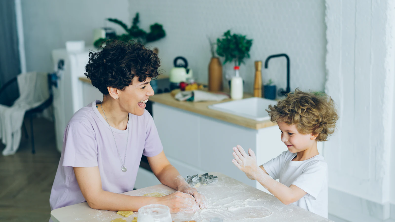 Mother and child talking at the kitchen table